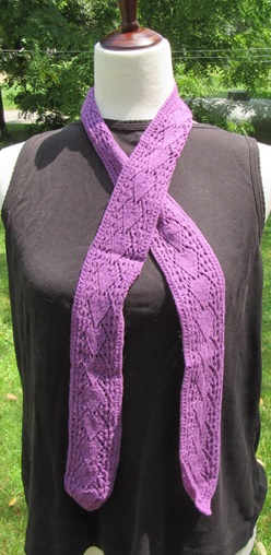 purple knit narrow scarf with an arrow like motif