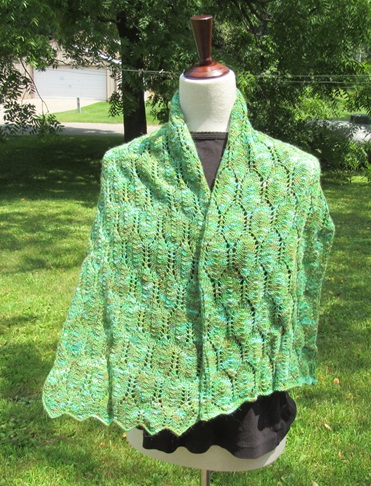 Light green variegated knit wrap with a long leaf motif